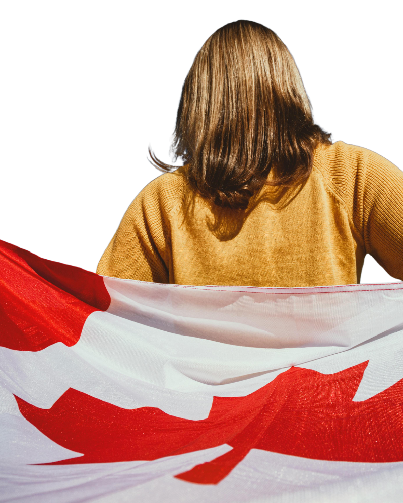 A person with shoulder-length hair, holding a Canadian flag, stands against a plain background, embodying resilience. Their journey navigates the challenges of visa refusal management expertly.