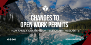 Overlay text on a picturesque lake and mountain backdrop: "Exciting changes for family members of temporary residents with open work permits.